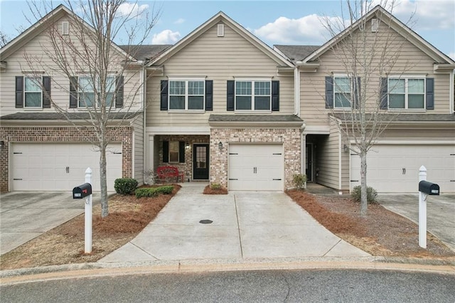 2785 Maple Park Pl, Cumming, GA 30041 - townhome / multi-family property with an attached garage, concrete driveway, and brick siding