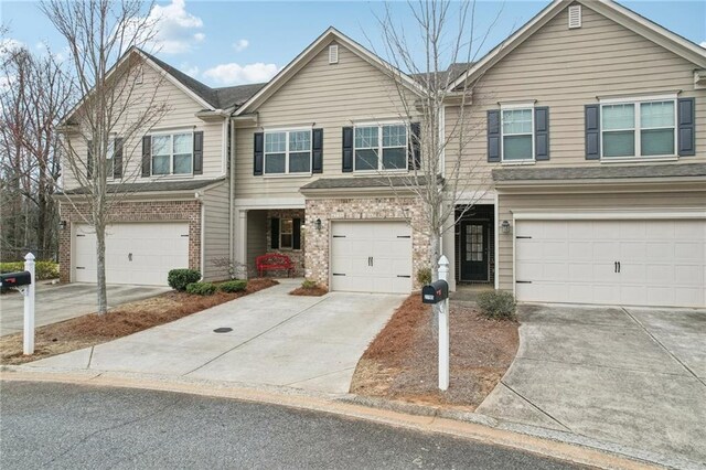 2785 Maple Park Pl, Cumming, GA 30041 - multi unit property featuring a garage, concrete driveway, and brick siding