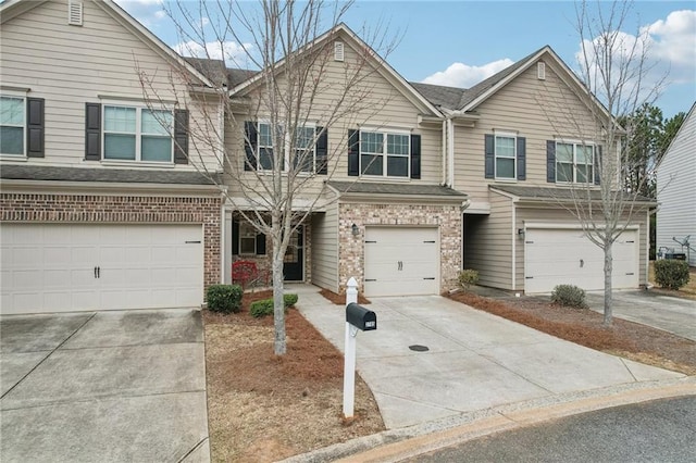 2785 Maple Park Pl, Cumming, GA 30041 - view of front of home featuring a garage, concrete driveway, and brick siding
