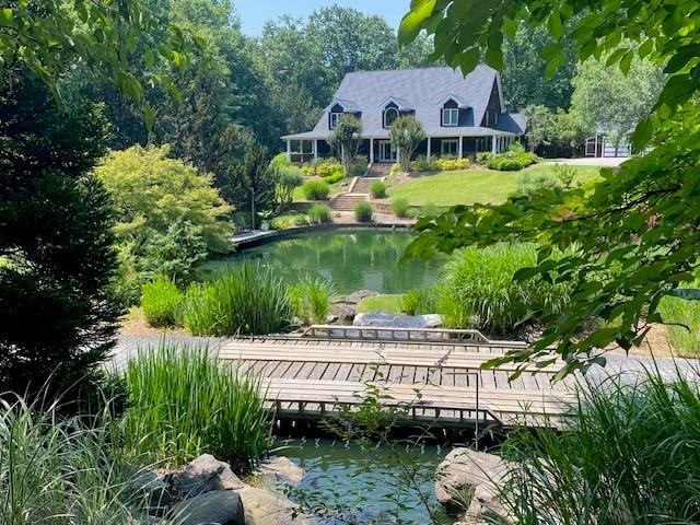 surrounding community featuring a water view