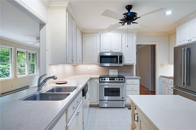 170 Mayfield Cir, Alpharetta, GA 30009 - kitchen featuring appliances with stainless steel finishes, ceiling fan, a sink, a baseboard radiator, and light countertops
