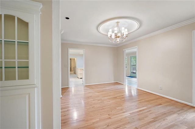 170 Mayfield Cir, Alpharetta, GA 30009 - spare room featuring light wood finished floors, crown molding, a chandelier, and baseboards