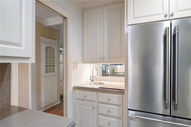 170 Mayfield Cir, Alpharetta, GA 30009 - kitchen featuring white dishwasher, a sink, crown molding, stainless steel range oven, and light countertops