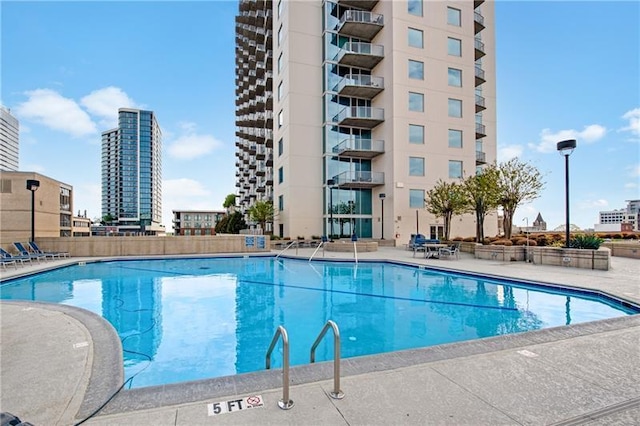 view of swimming pool with a patio area