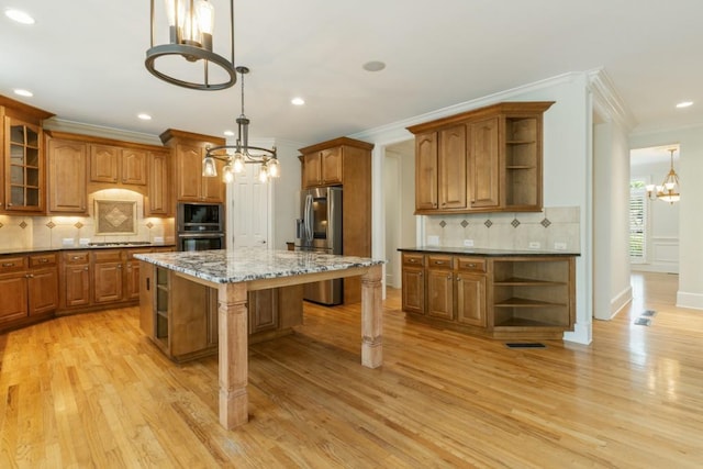 1565 Briergate Dr, Duluth, GA 30097 - kitchen featuring open shelves, a chandelier, stainless steel appliances, brown cabinets, and crown molding