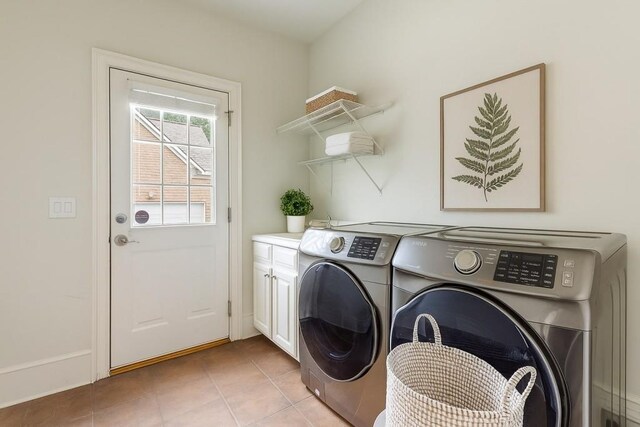 1565 Briergate Dr, Duluth, GA 30097 - laundry area with washing machine and clothes dryer, cabinet space, and light tile patterned floors