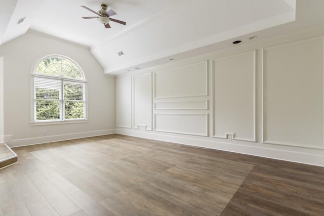 1565 Briergate Dr, Duluth, GA 30097 - empty room featuring wood finished floors, a ceiling fan, and vaulted ceiling