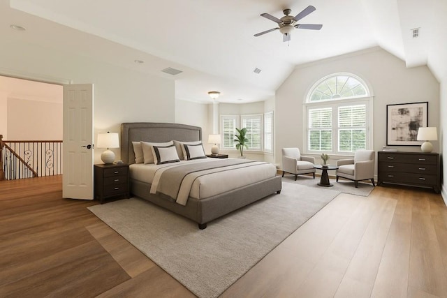 1565 Briergate Dr, Duluth, GA 30097 - bedroom featuring wood finished floors, vaulted ceiling, and a ceiling fan