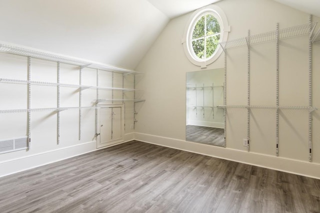 1565 Briergate Dr, Duluth, GA 30097 - spacious closet with wood finished floors and lofted ceiling