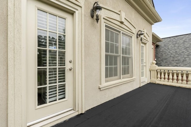 1565 Briergate Dr, Duluth, GA 30097 - property entrance with a shingled roof and stucco siding