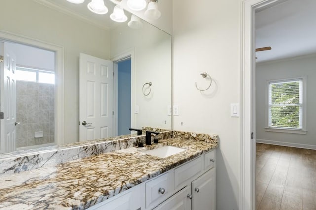 1565 Briergate Dr, Duluth, GA 30097 - bathroom with ornamental molding, vanity, and wood finished floors