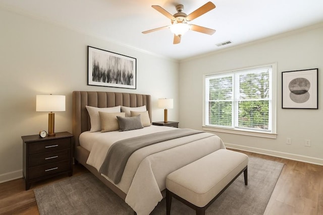 1565 Briergate Dr, Duluth, GA 30097 - bedroom with wood finished floors, ornamental molding, and a ceiling fan