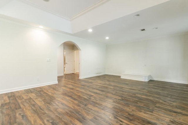 1565 Briergate Dr, Duluth, GA 30097 - empty room featuring dark wood finished floors, ornamental molding, arched walkways, and recessed lighting