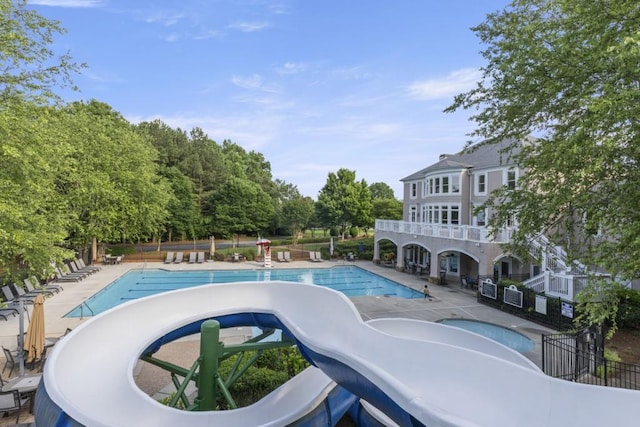 1565 Briergate Dr, Duluth, GA 30097 - community pool with a hot tub, a patio area, and view of wooded area