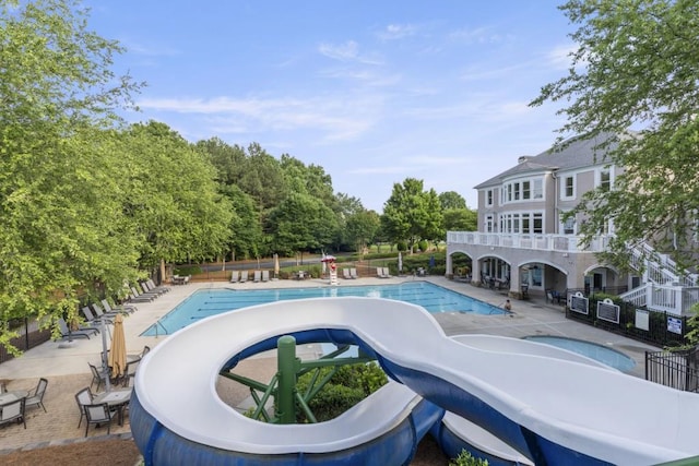 1565 Briergate Dr, Duluth, GA 30097 - community pool with a jacuzzi, a patio area, and view of scattered trees