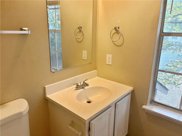 bathroom featuring vanity and toilet