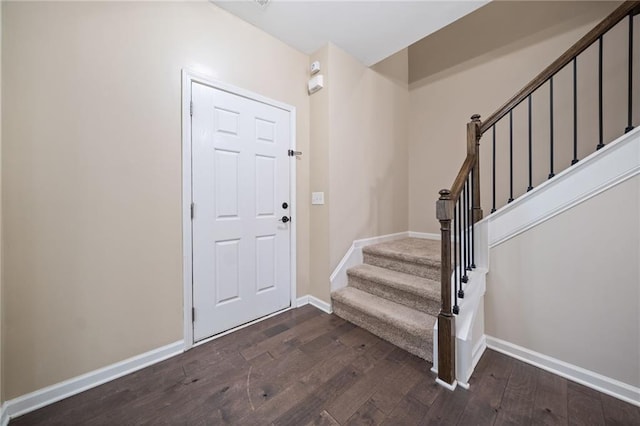 foyer with dark hardwood / wood-style floors