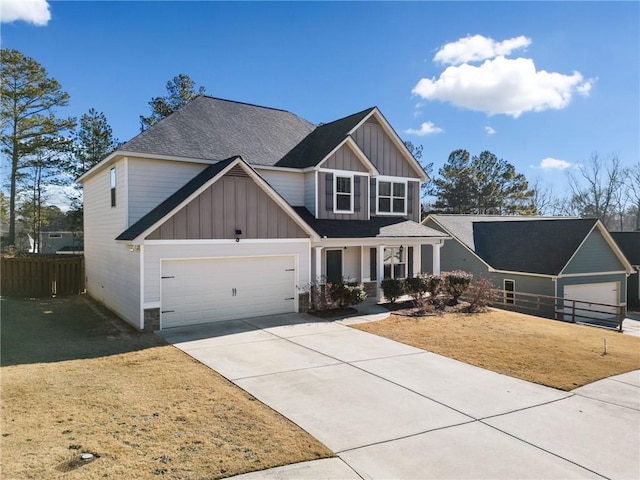 craftsman-style house featuring a front yard and a garage