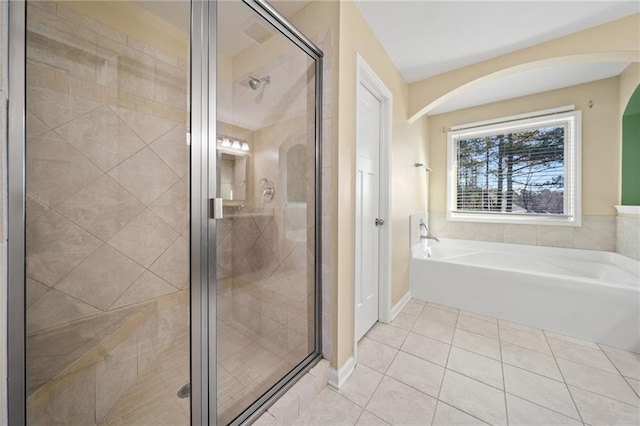 bathroom featuring plus walk in shower and tile patterned flooring