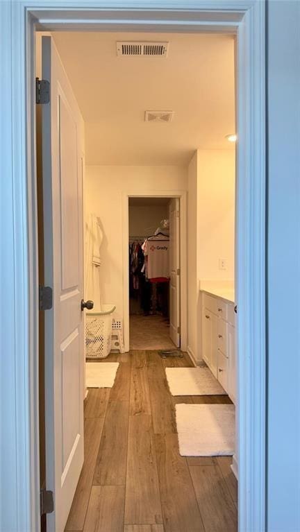 hallway featuring light hardwood / wood-style flooring