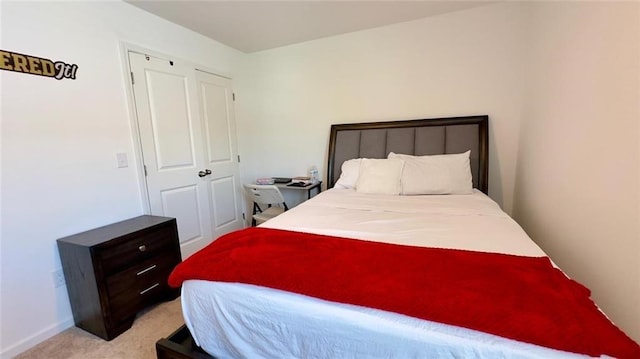 bedroom featuring light carpet