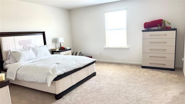 bedroom featuring light carpet