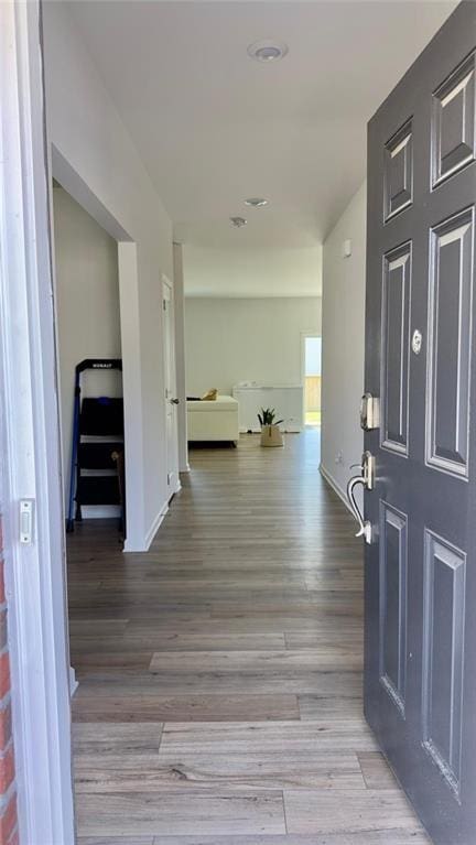 hallway with light wood-type flooring