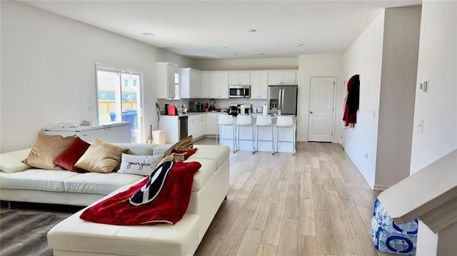 living room with light hardwood / wood-style floors