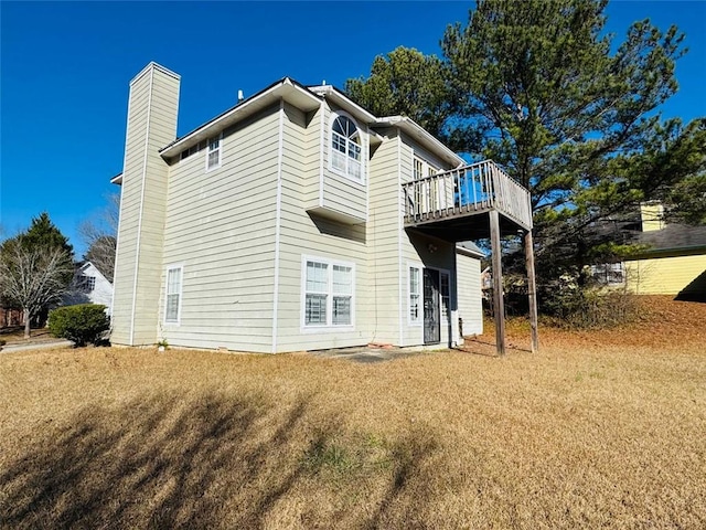 back of house with a yard