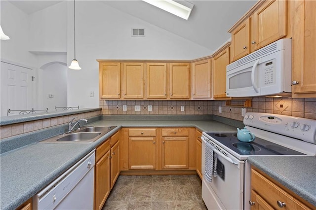 kitchen with white appliances, visible vents, a sink, pendant lighting, and backsplash