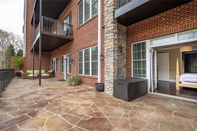 view of patio with a balcony