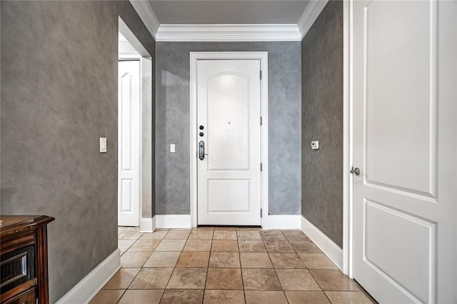 entrance foyer featuring light tile patterned floors, crown molding, and baseboards