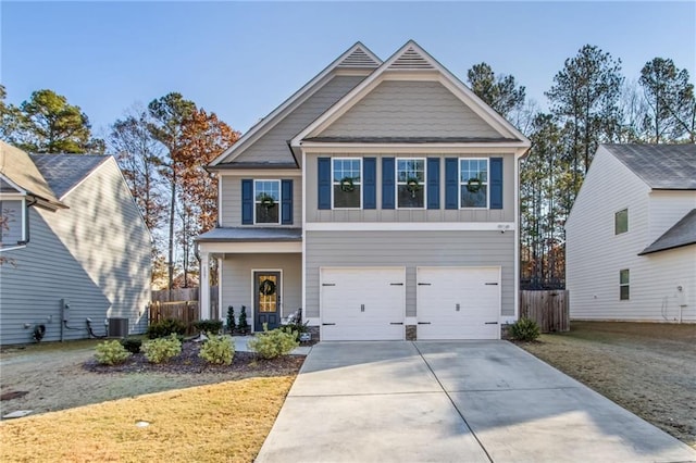 craftsman-style home featuring central AC, a porch, and a garage