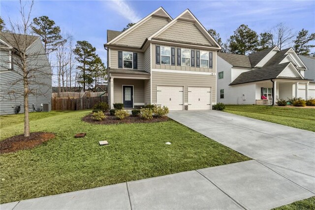 view of front of house with a garage and a front yard