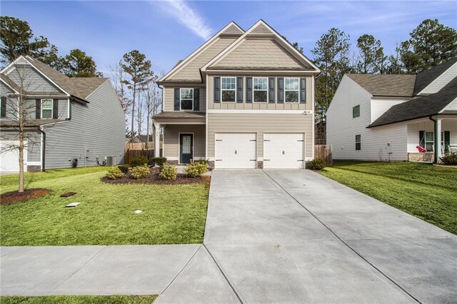 craftsman house with a garage, a porch, central air condition unit, and a front lawn