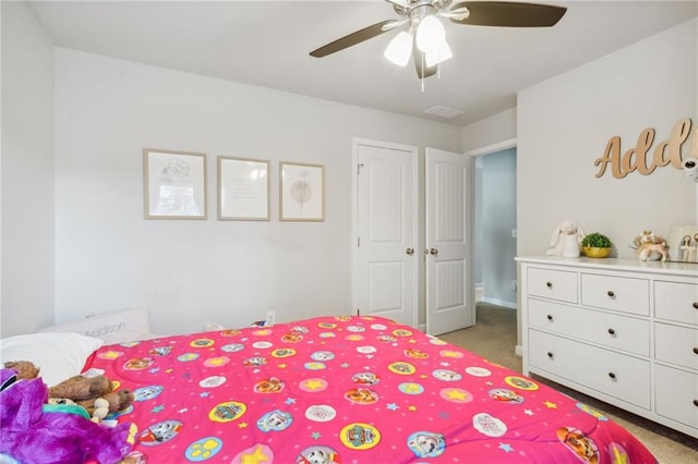 carpeted bedroom with ceiling fan