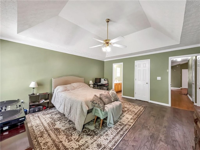204 Bluff Ct, Jackson, GA 30233 - bedroom with a tray ceiling, wood finished floors, baseboards, a ceiling fan, and crown molding