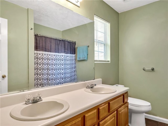 204 Bluff Ct, Jackson, GA 30233 - bathroom featuring toilet, double vanity, a shower with curtain, and tile patterned floors