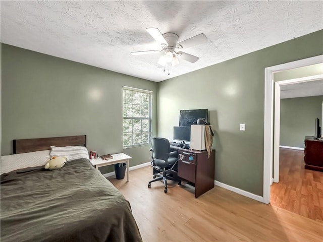 204 Bluff Ct, Jackson, GA 30233 - bedroom with wood finished floors, a desk, baseboards, and a textured ceiling