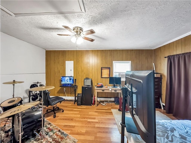 204 Bluff Ct, Jackson, GA 30233 - office space with attic access, ceiling fan, light wood-type flooring, a textured ceiling, and wooden walls