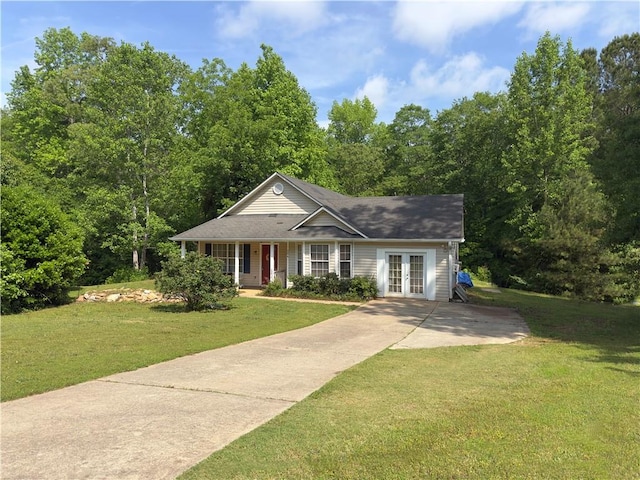 204 Bluff Ct, Jackson, GA 30233 - view of front facade with french doors, a front lawn, concrete driveway, and covered porch