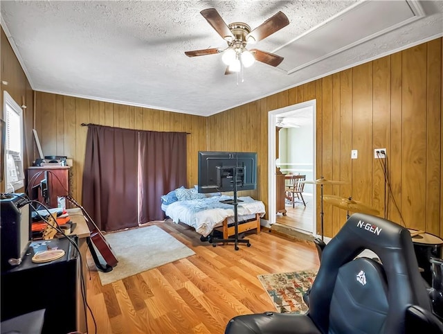 204 Bluff Ct, Jackson, GA 30233 - bedroom featuring wood walls, a textured ceiling, attic access, wood finished floors, and crown molding