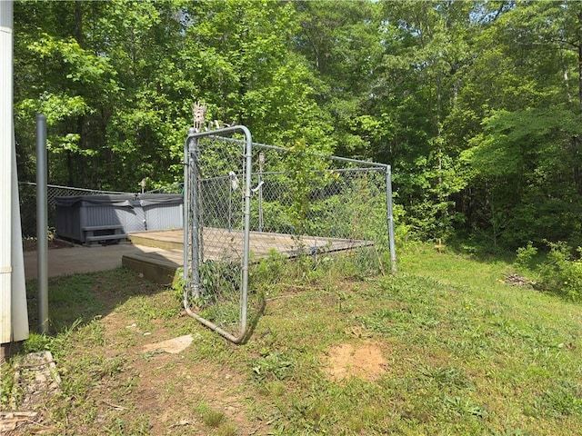 204 Bluff Ct, Jackson, GA 30233 - view of yard with a wooded view and a hot tub