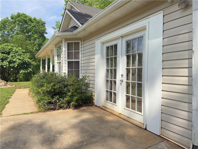 204 Bluff Ct, Jackson, GA 30233 - view of home's exterior with french doors, a patio, and roof with shingles