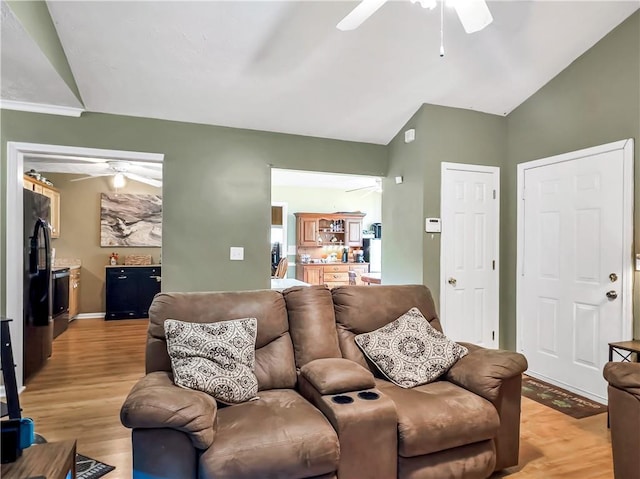204 Bluff Ct, Jackson, GA 30233 - living room with ceiling fan, vaulted ceiling, light wood-style flooring, and baseboards