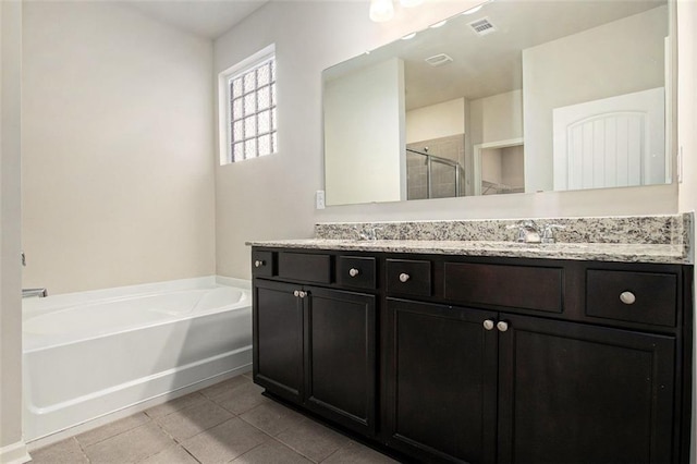 full bathroom with visible vents, a stall shower, a sink, tile patterned flooring, and a bath