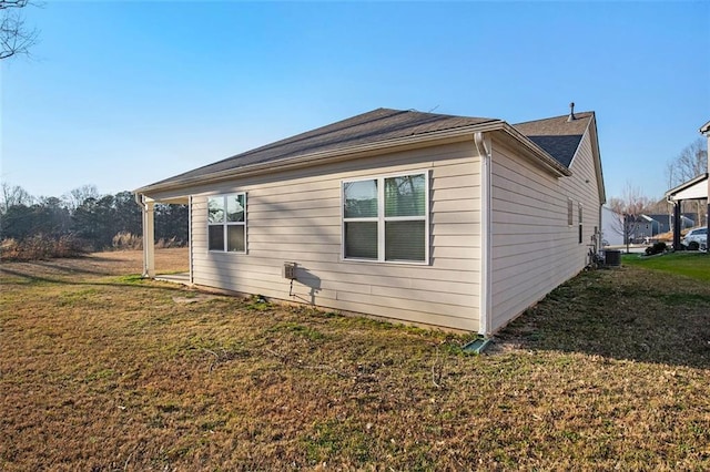 view of home's exterior with a yard