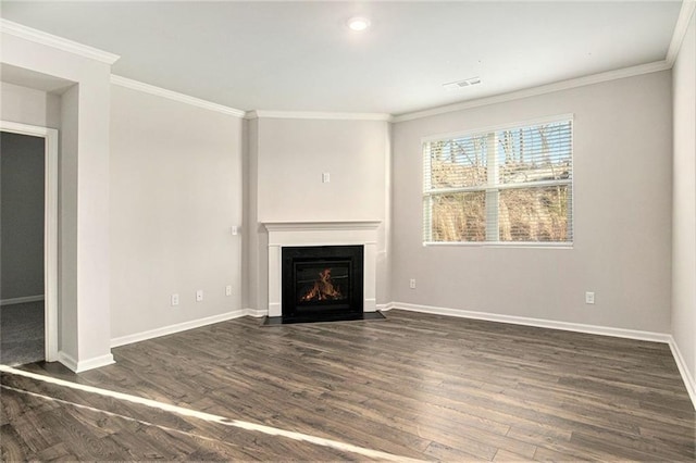 unfurnished living room featuring visible vents, a fireplace with flush hearth, ornamental molding, dark wood finished floors, and baseboards