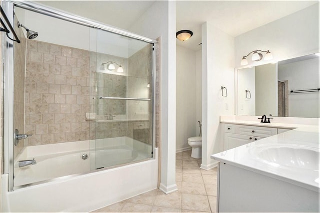 full bathroom featuring tile patterned flooring, vanity, combined bath / shower with glass door, and toilet