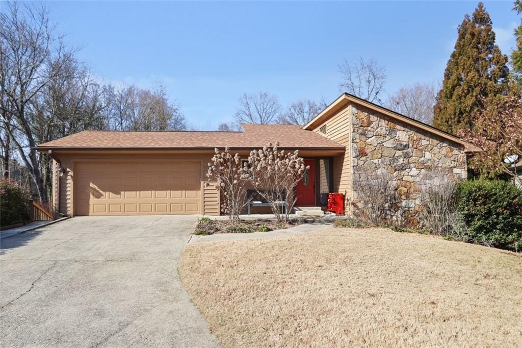 single story home with a garage